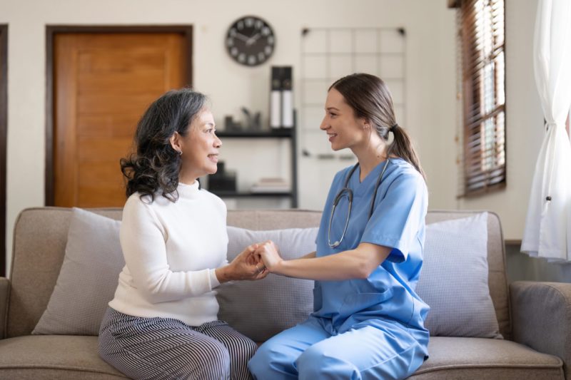 what to expect after a hysterectomy - nurse providing support to woman post hysterectomy