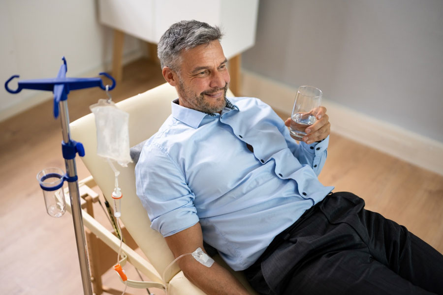 man receiving IV therapy to illustrate IV detox