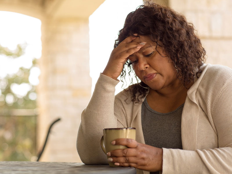 African-American woman looking sad to illustrate needing a hormone imbalance checklist