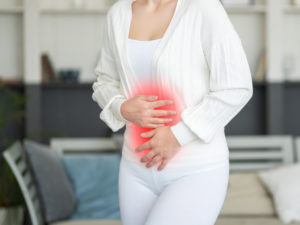 woman experiencing endometriosis pain causing a hysterectomy