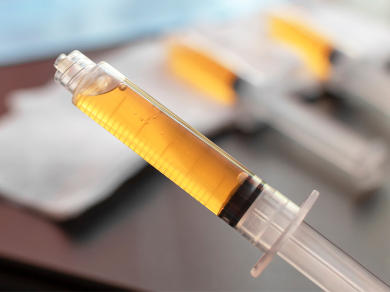 full syringe to illustrate peptide therapy