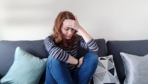 woman not feeling well to illustrate possible fever after hysterectomy