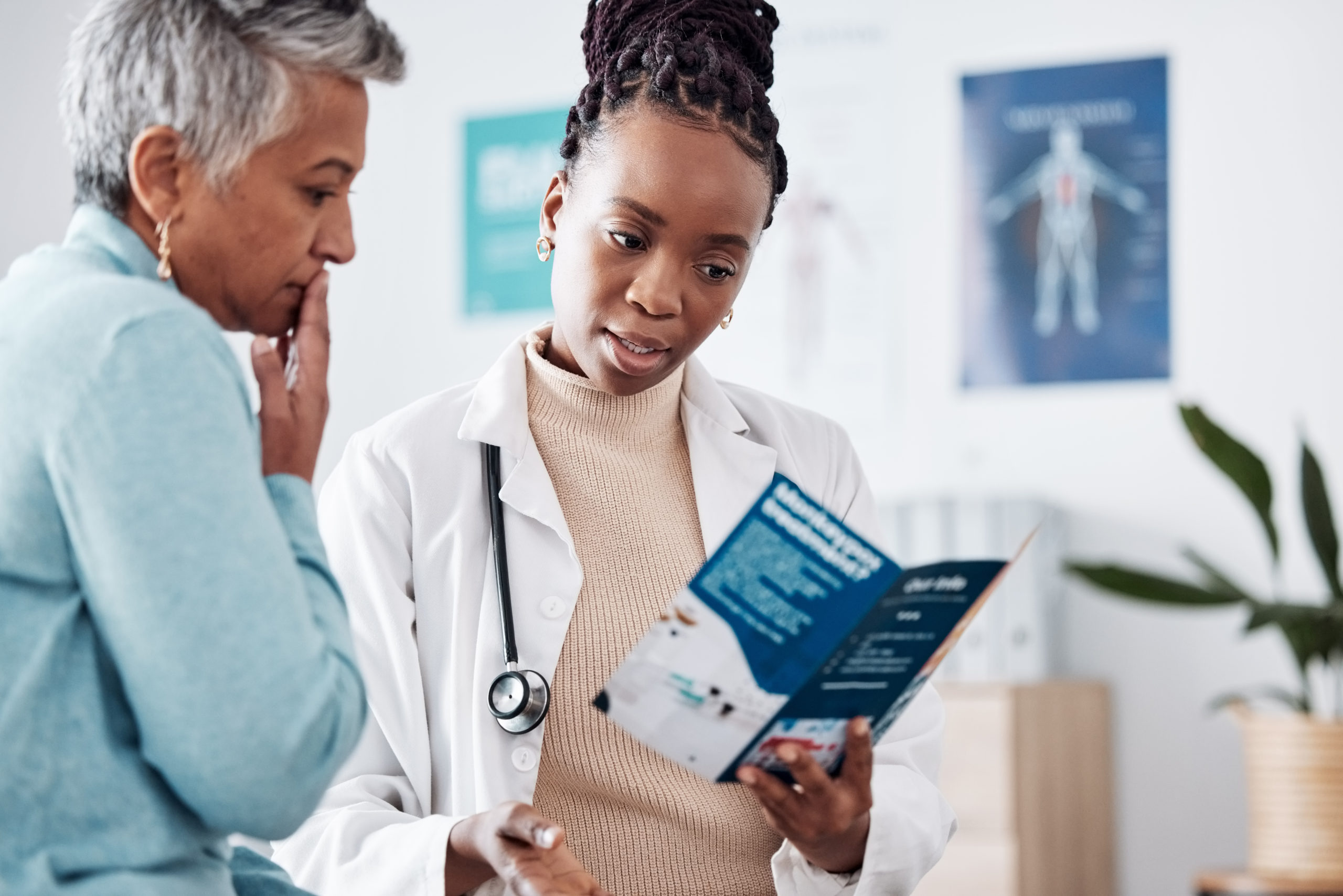 Brochure, consulting or doctor talking to patient for life insurance or healthcare services or medical data. Medicine, nurse helping or mature woman learning info on pamphlet in hospital for advice