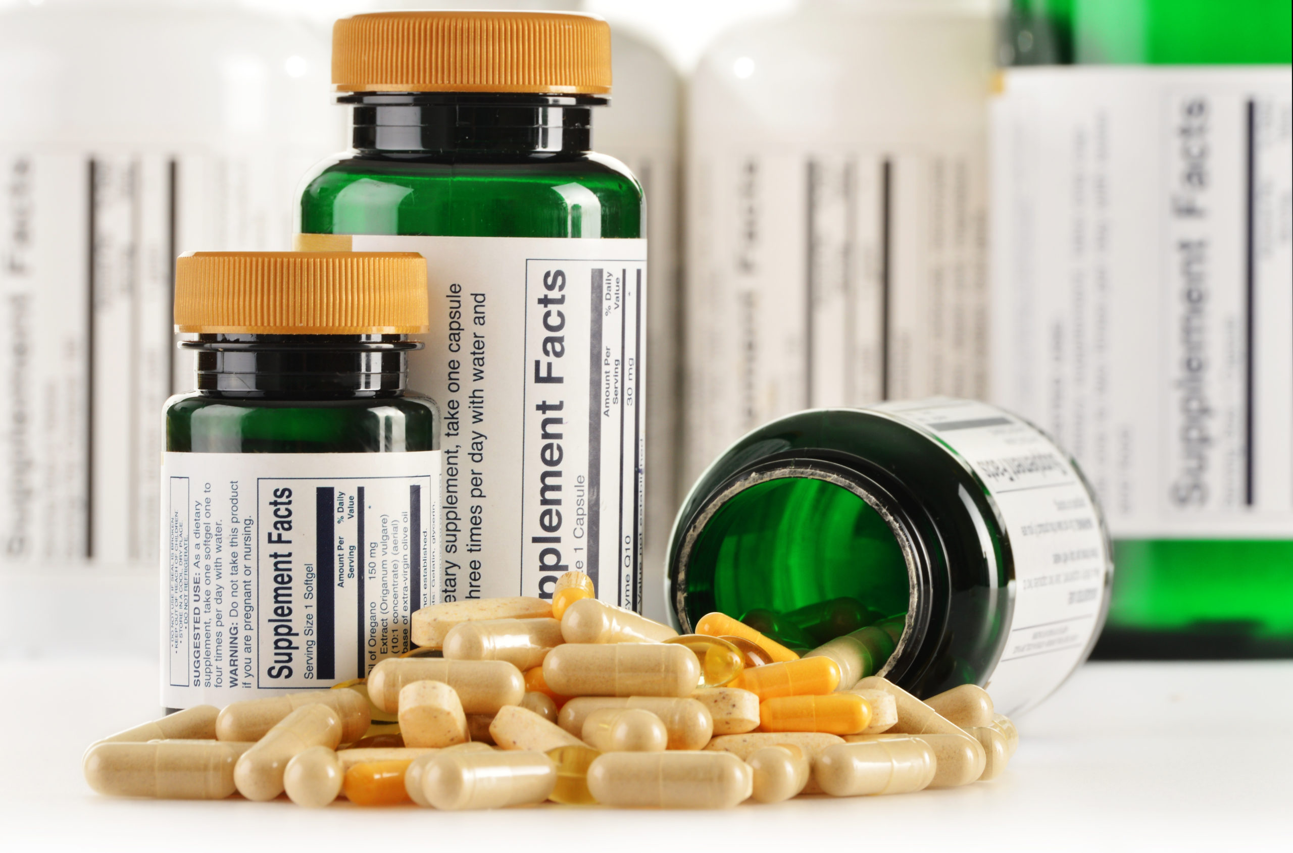 Composition with dietary supplement capsules. Drug pills