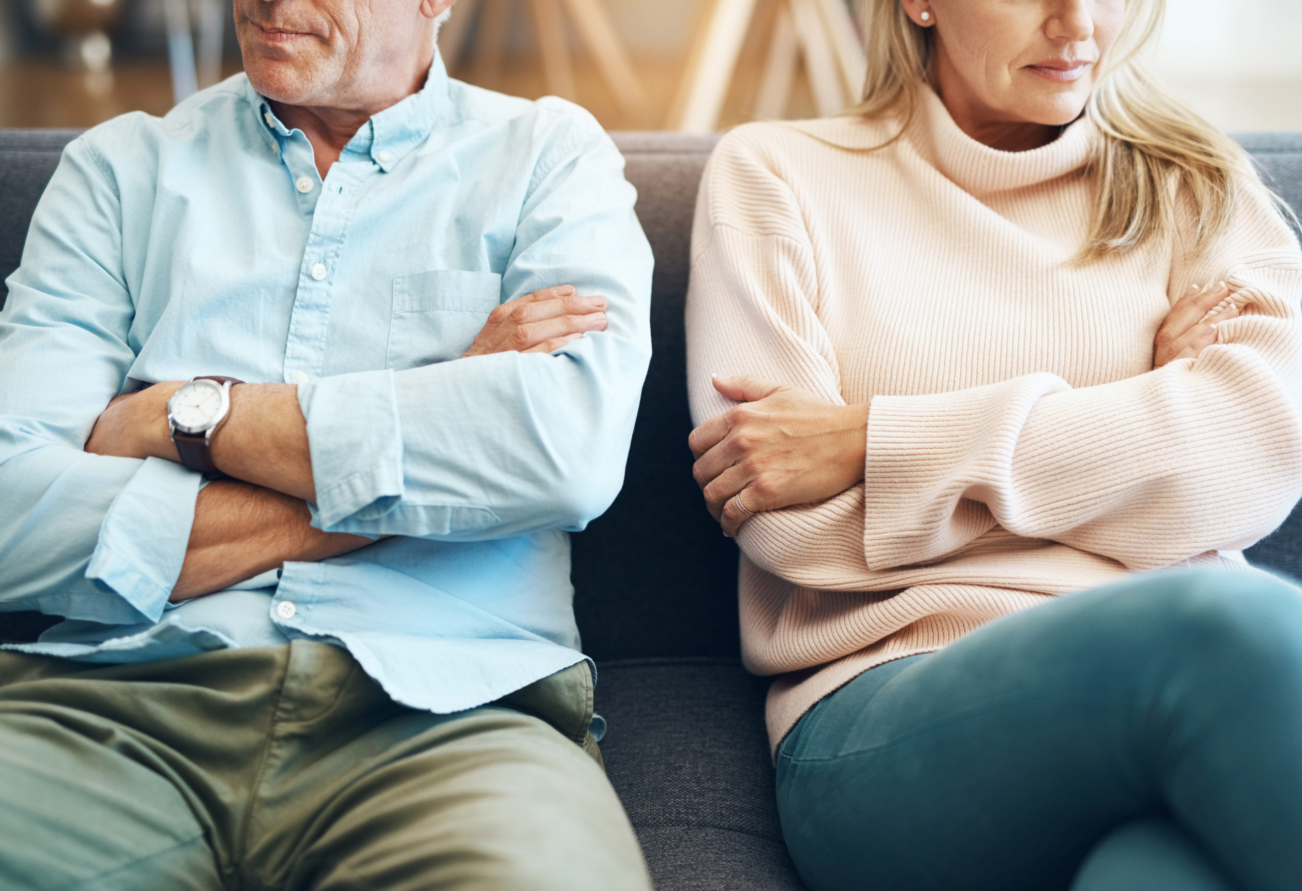 Divorce, fail and couple fight due to marriage problem, angry at home about family law and with conflict in a lounge. Anger, sad and people or partner frustrated due to infertility on a sofa