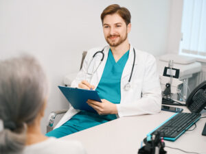 young docotr communicating with an elderly patient about integrative and functional medicine