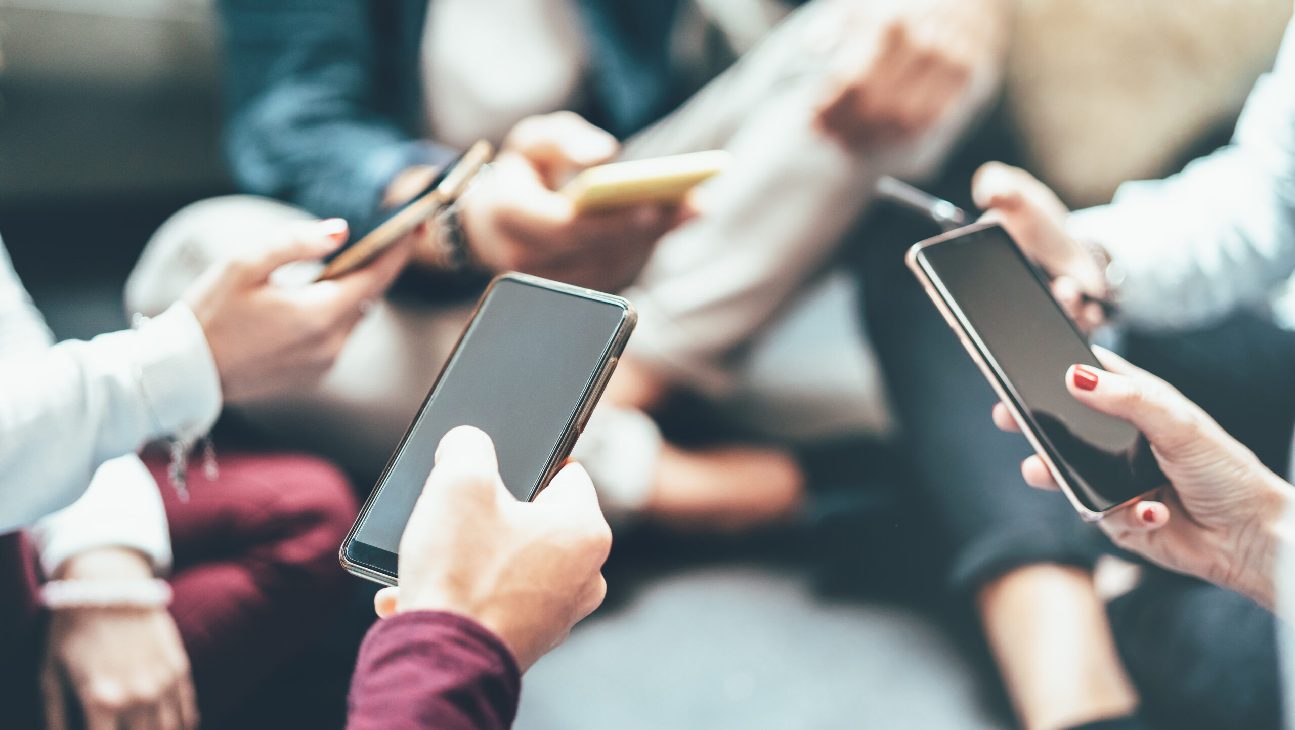 Friends group having addicted fun using mobile smart phone - Close up of people hands sharing content on social media network with smartphone - Technology concept with millennials online with cellphone